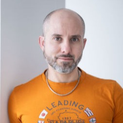 Portrait of judge Braňo Fidler speaking on stage