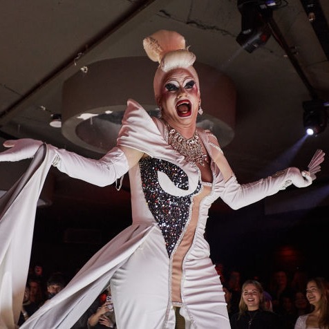 Portrait of judge Valerie Divine wearing a feathered look